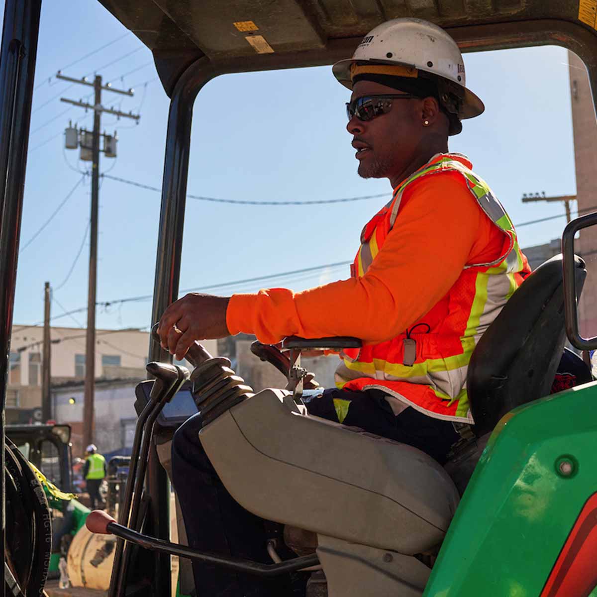 Electrician Trainee working a backhoe